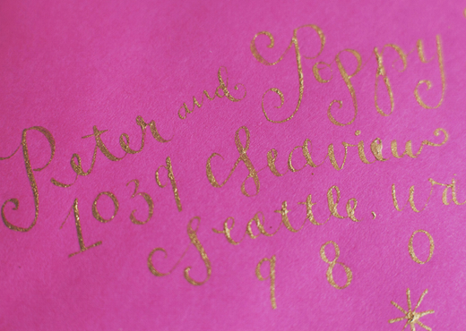 pink envelope with gold calligraphy design sponge