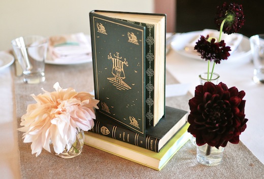 simple book centerpiece with bud vases