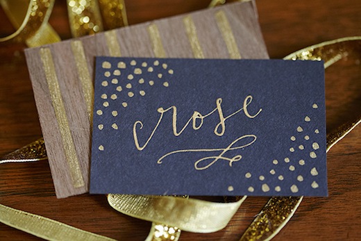 gold and wood escort cards la happy seattle event designer